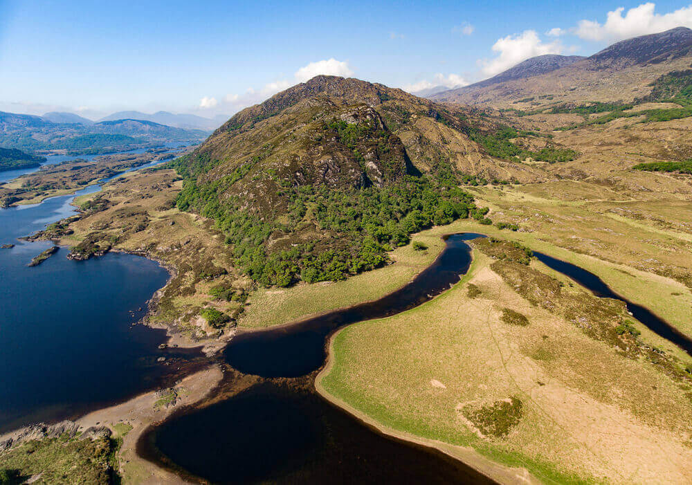 Aerial Panorama view Killarney National Park on the Ring of Kerry, County Kerry, Ireland. Beautiful panoramic scenic aerial of a natural irish countryside landscape. Part of the Wild Atlantic Way. Ireland road trip