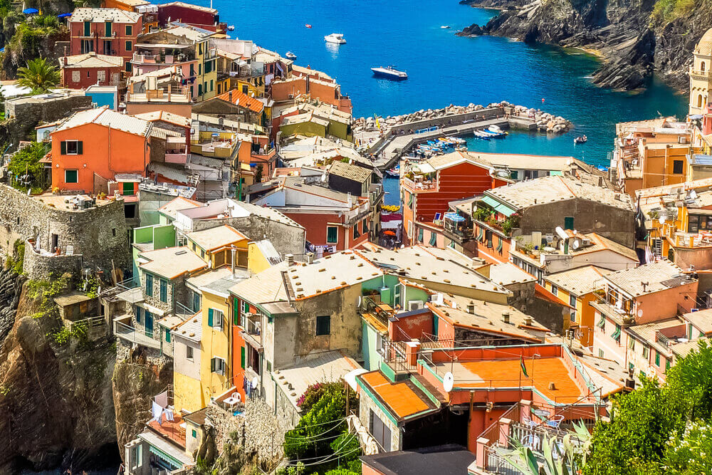planning a trip to Italy. Beautifil view from high hill of Vernazza houses and blue sea, Cinque Terre national park, Liguria, Italy.