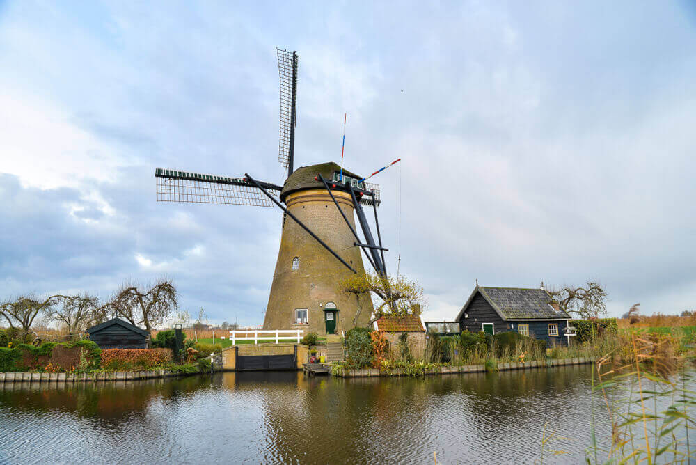 plan a trip to Europe. Beautiful old windmills in Kinderdijk. Autumn morning in Holland, Netherlands.