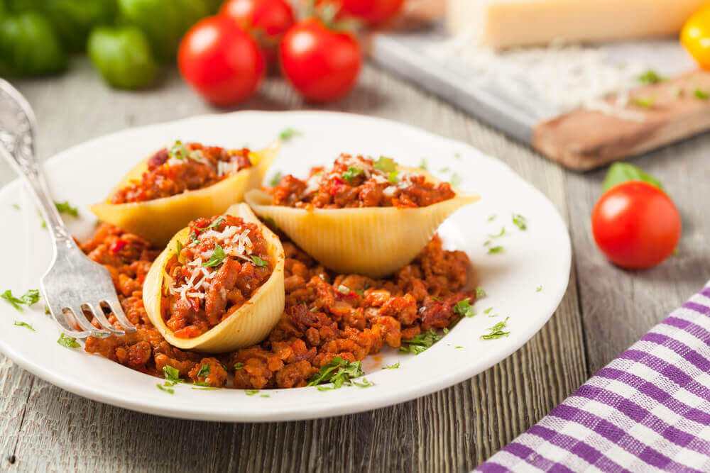 Italian pasta Conchiglioni Rigati stuffed with dry tomatoes and meat. attractions in Italy