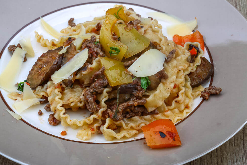Italian traditional Pasta mafalde with herbs and beef meat. attractions in Italy