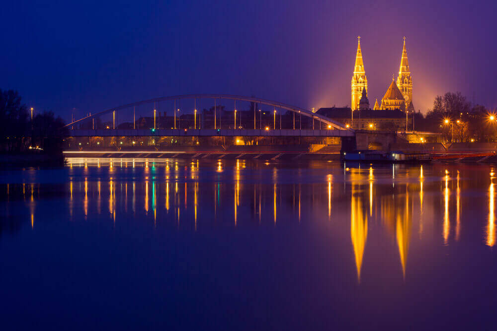 road trip map. Night view of Szeged city from the other side of Tisza River-Hungary