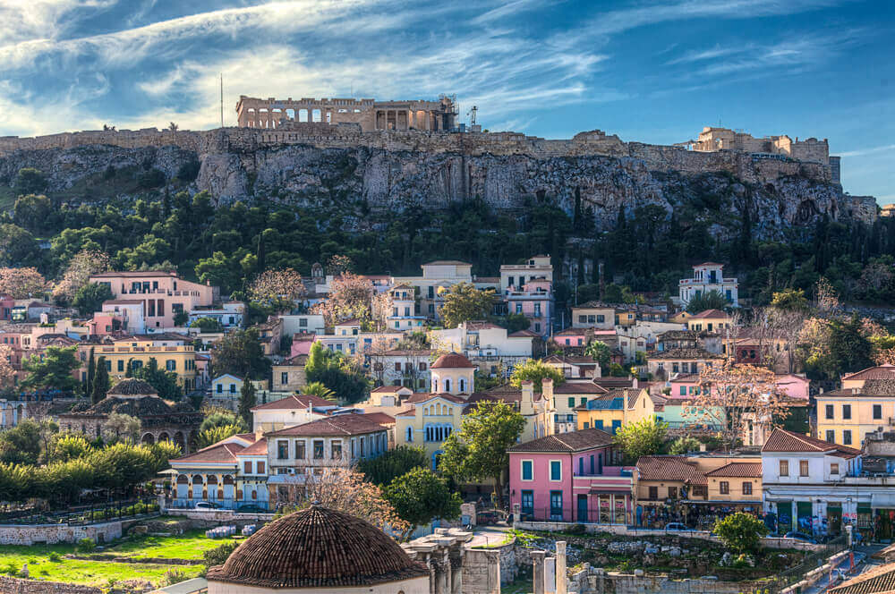 View of the Acropolis looking over colourful city of Athens. online trip planner.