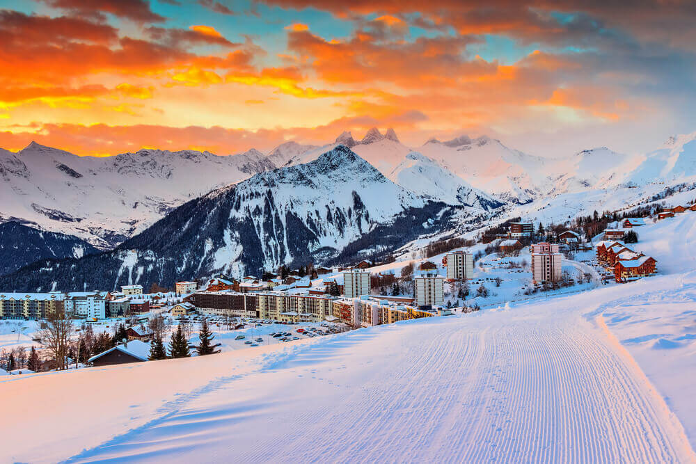 Majestic winter sunrise landscape and ski resort in French Alps