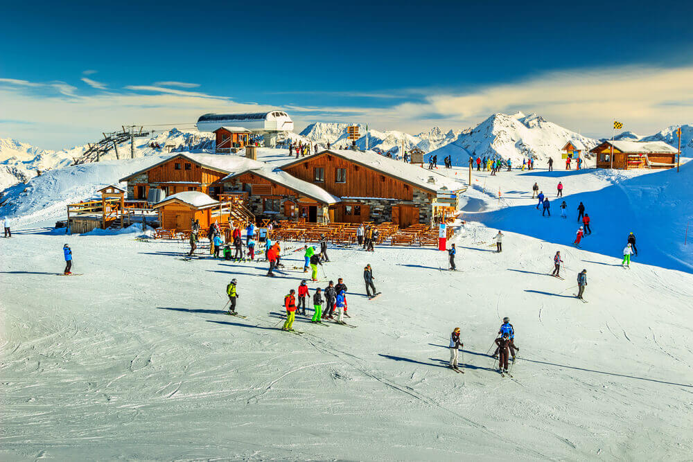 Wooden chalets and ski slopes in France